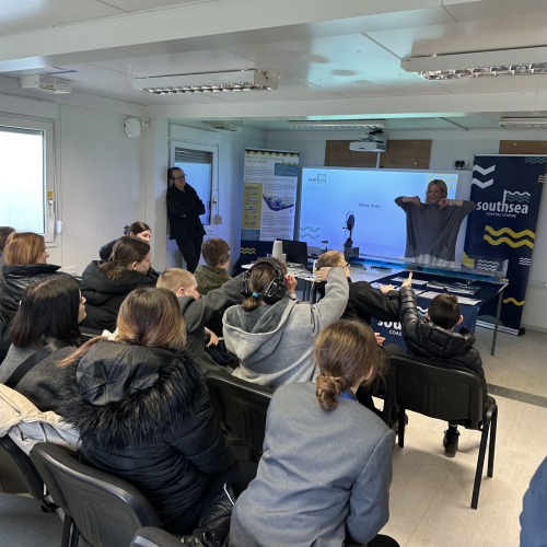 Member of VolkerStevin giving a presentation to students visiting the Southsea Coastal Scheme 