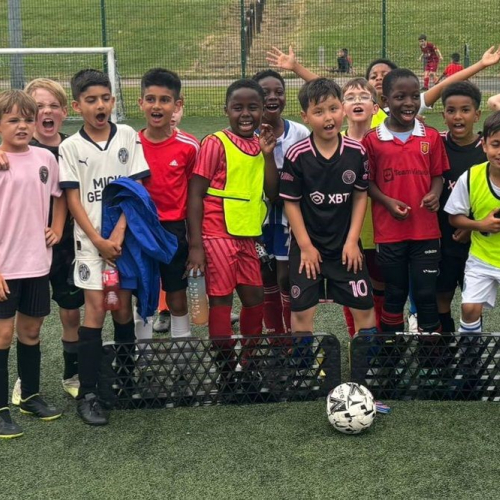 Picture of children playing football.