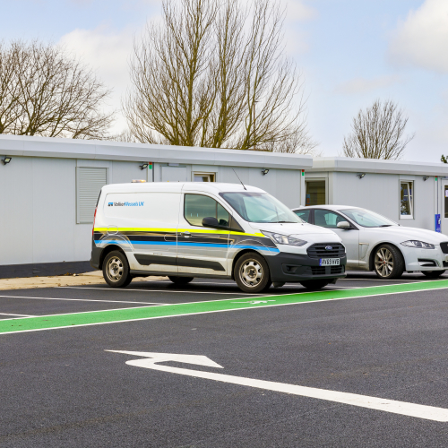 Site cabins with van parked outside