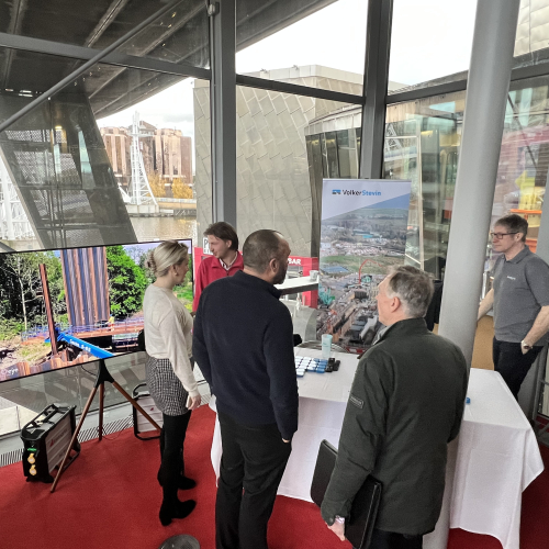 People gathered around an exhibition stand