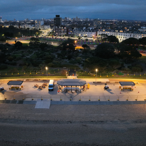 Southsea promenade lit up in the evening showing shelters