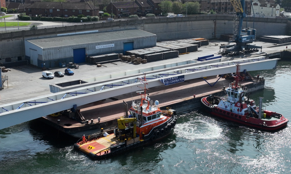 Footbridge sections on a barge in a port