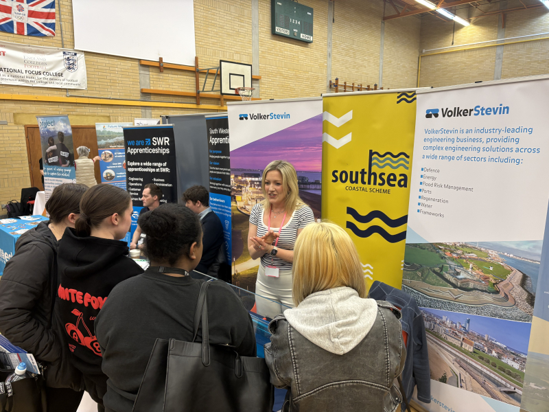 Group of students at a stand at careers fair