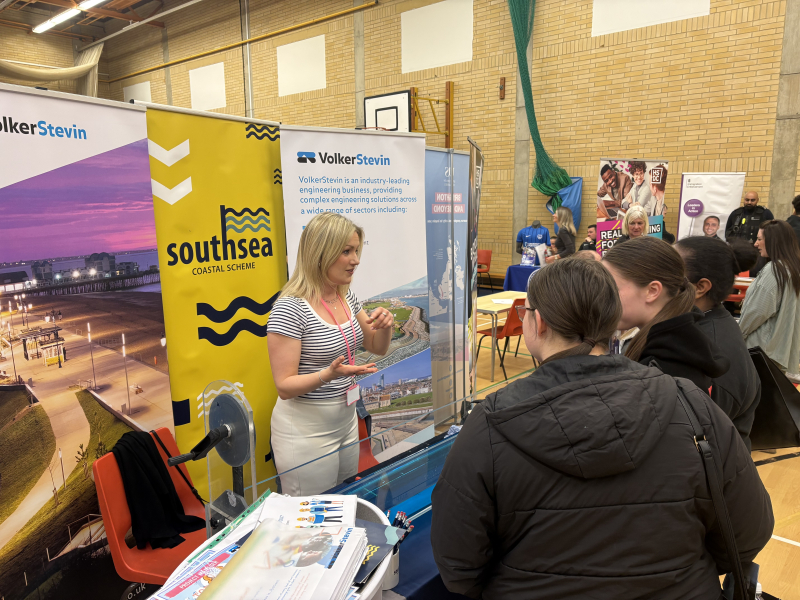 Group of students at a stand at a careers fair