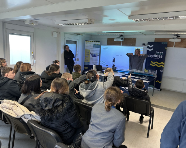 Member of VolkerStevin giving a presentation to students visiting the Southsea Coastal Scheme 