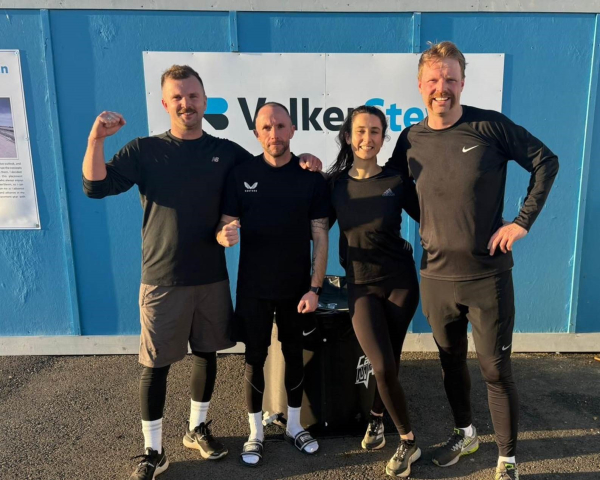 Picture of three men and a girl after a run.