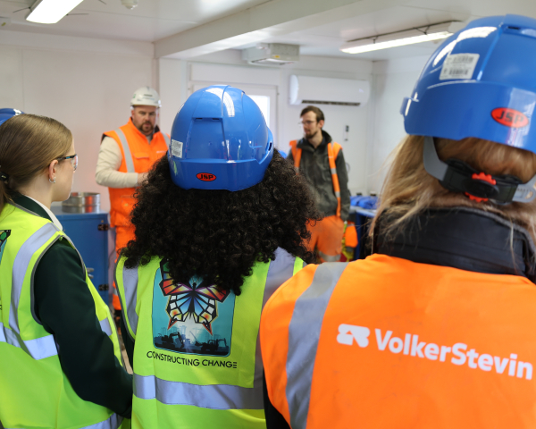 Girls in PPE listening to a presentation.