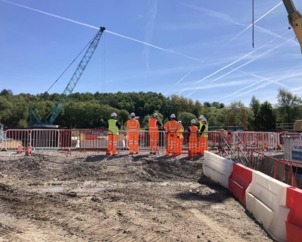 People on site in PPE.