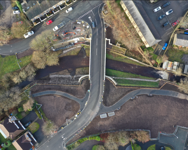 New 21m span bridge following rewidening of river and removal of existing bridge and footbridge.png