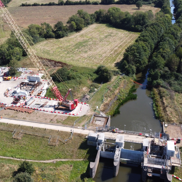 Gate being installed by a crane