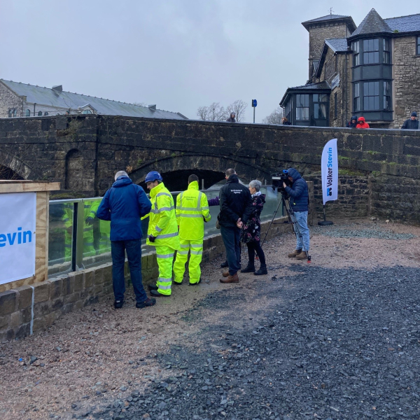 ITV BOrder, Cumberland Council , Kendal Town Council and EA representatives viewing the first glass panels.jpg