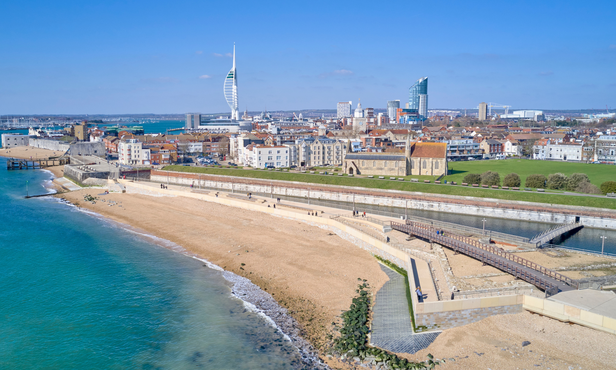 promenade beach front blue sea and blue skies 