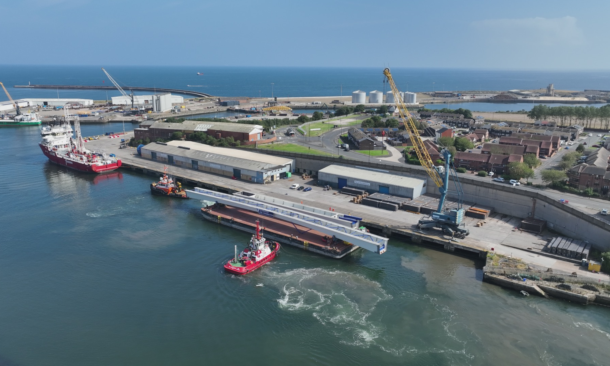 Footbridge section on barge sailing from a port