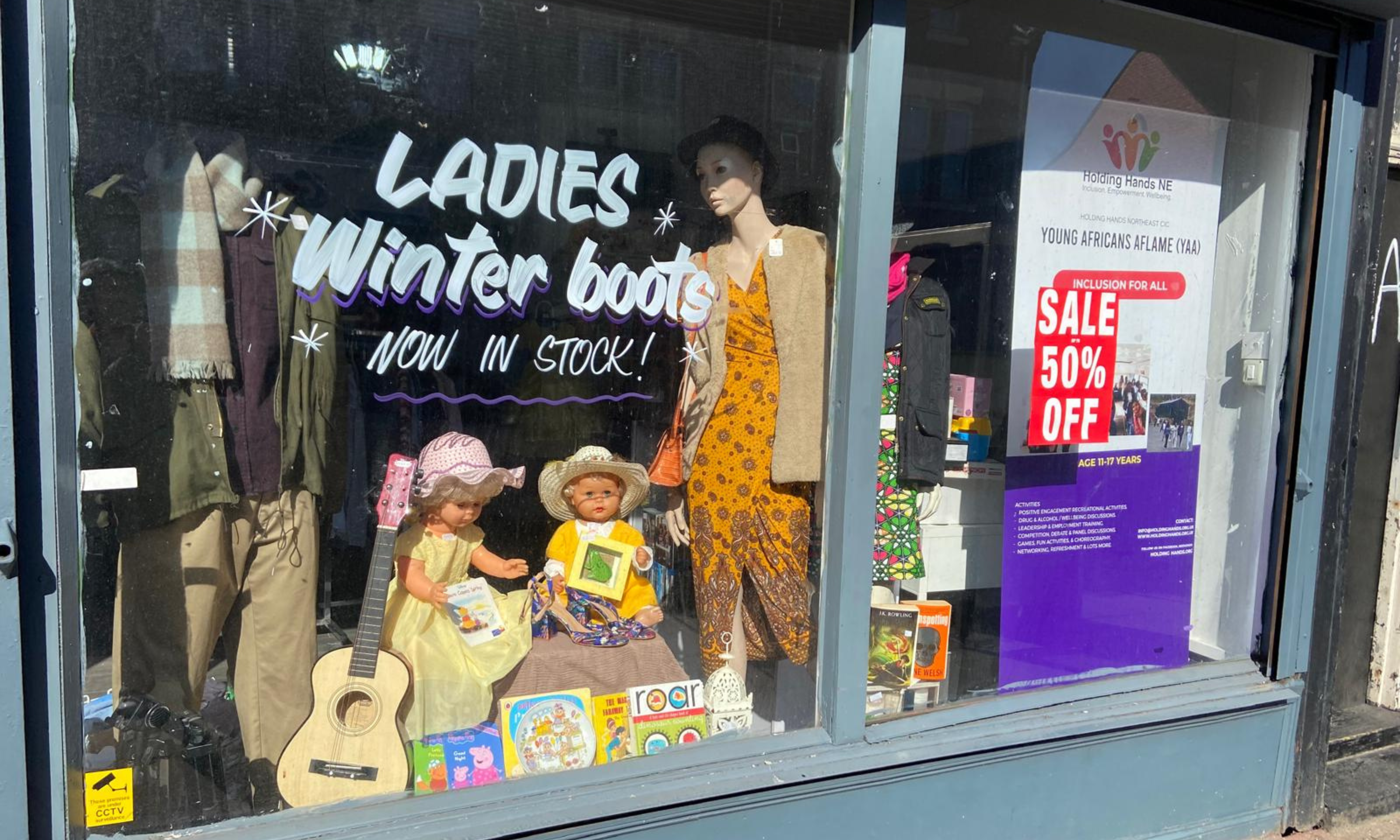 Picture of a charity shop window.